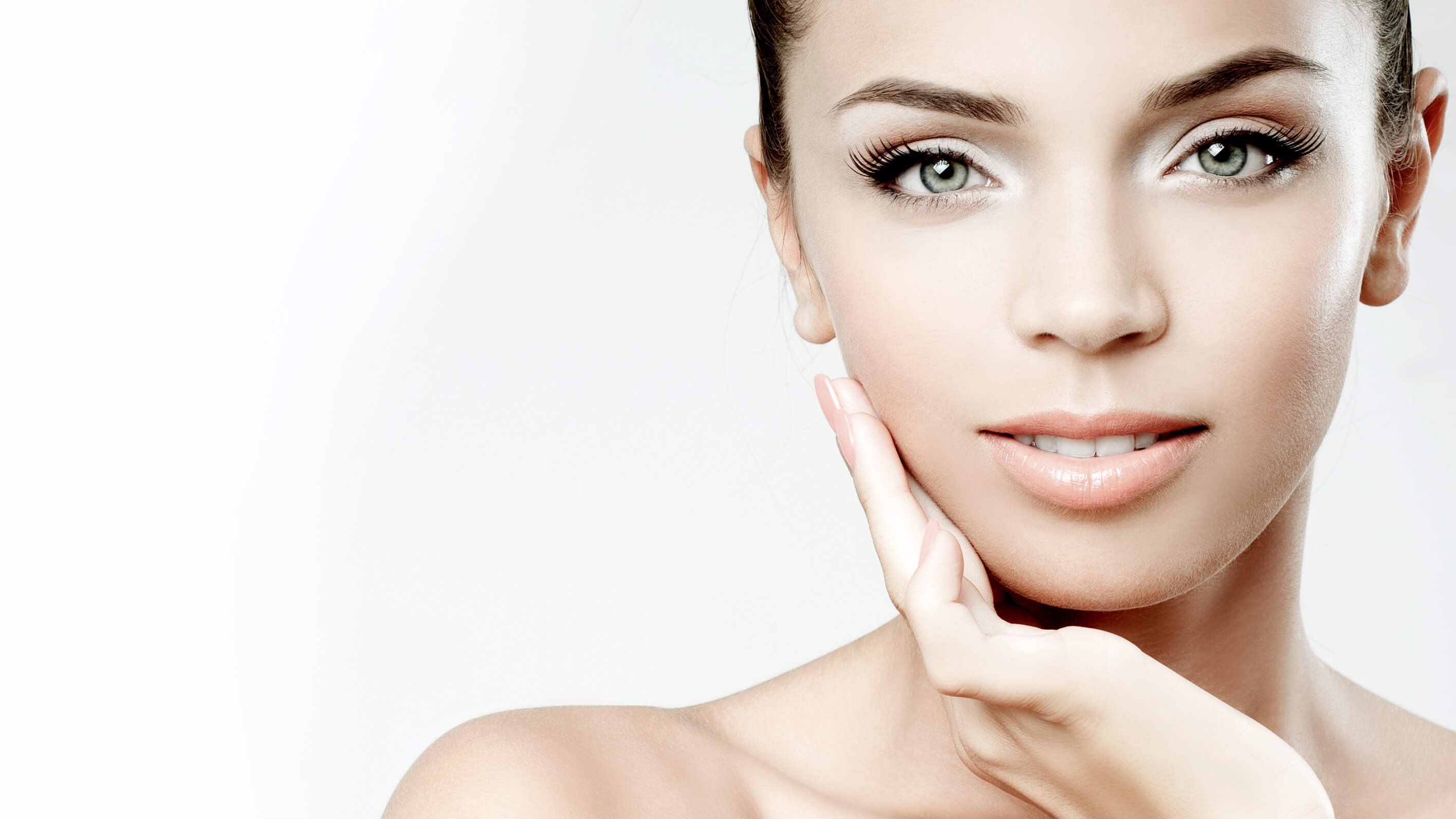 woman with hand on her face